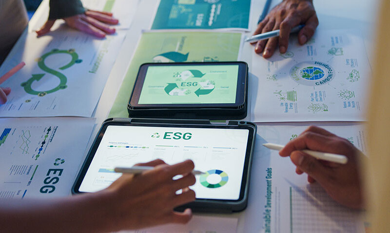 Closeup group businesspeople talk ESG strategies risk management workshop night, SDGs, global warming, green finance and investment and net zero waste lifestyle in boardroom training buildin